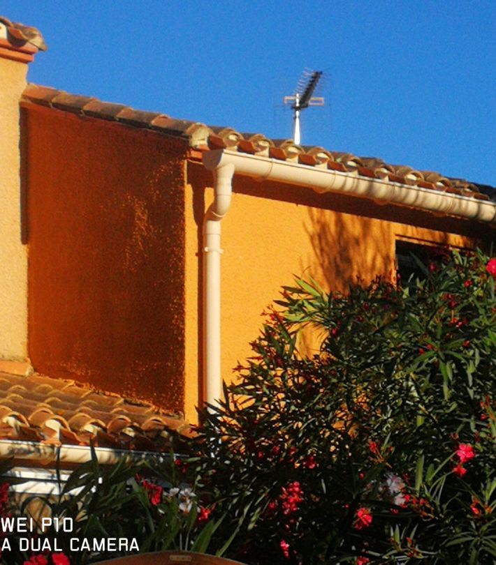 Artisan MASSET PEINTURE appliquant Thermacote sur mur extérieur à Toulouse